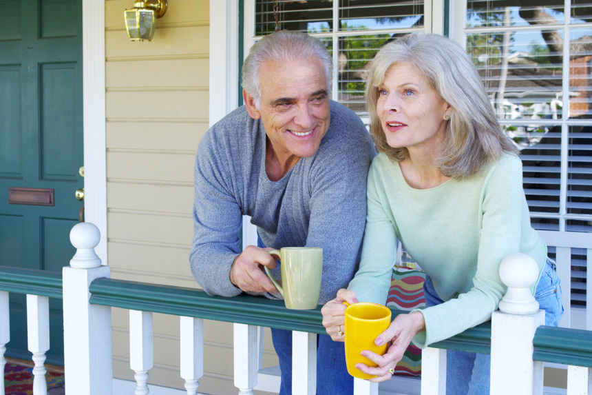 Mature couple having tea on the porch